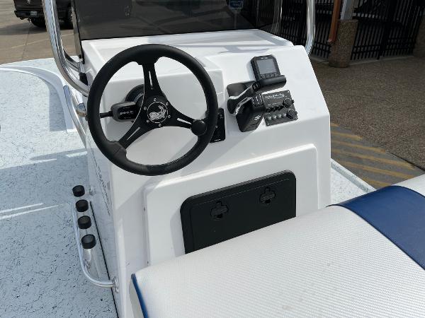 Slide: The Image of 2024 Shallow Stalker SS-17 Sportsman boat console with steering wheel and controls. - 15