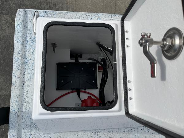 Slide: The Image of 2024 Shallow Stalker SS-17 Sportsman storage compartment with wiring and battery. - 18