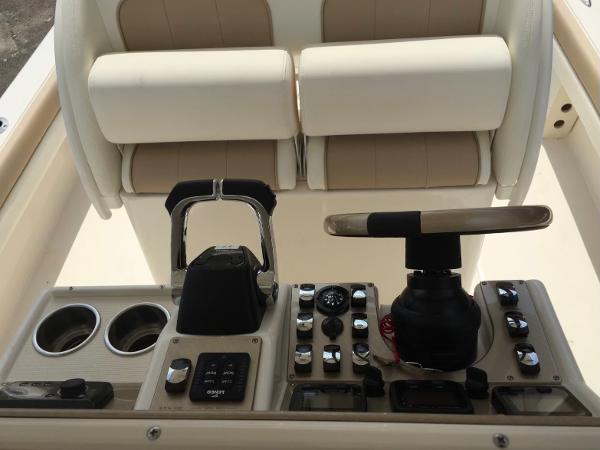 Slide: The Image of Control console of a 2015 ShearWater 26 Carolina Flair boat. - 4