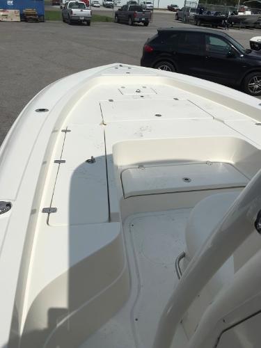 Slide: The Image of 2015 ShearWater 26 Carolina Flair boat deck in a parking lot. - 7