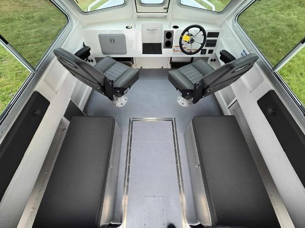 Slide: The Image of Interior of 2024 Silver Streak RENFREW boat with seating and steering wheel. - 3