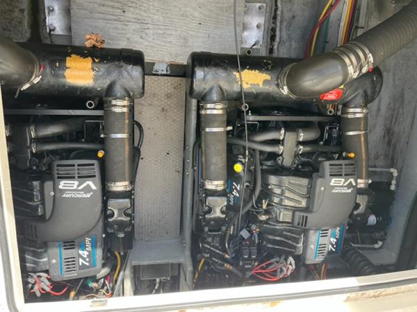 Slide: The Image of 2001 Silverton 330 Sport Bridge engine compartment with twin V8 engines. - 27