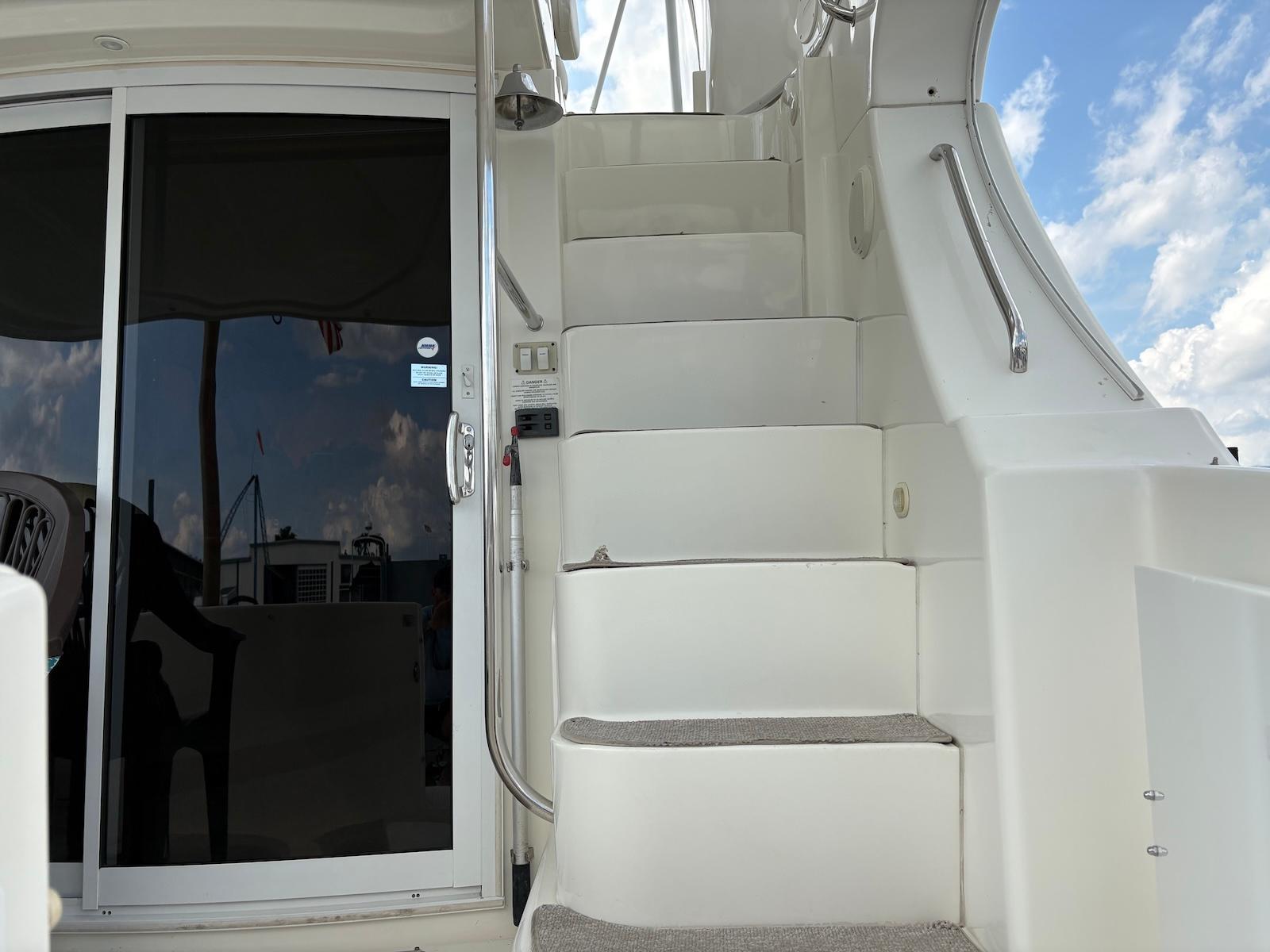 Slide: The Image of Staircase and sliding door on 2006 Silverton 38 Sport Bridge yacht. - 19
