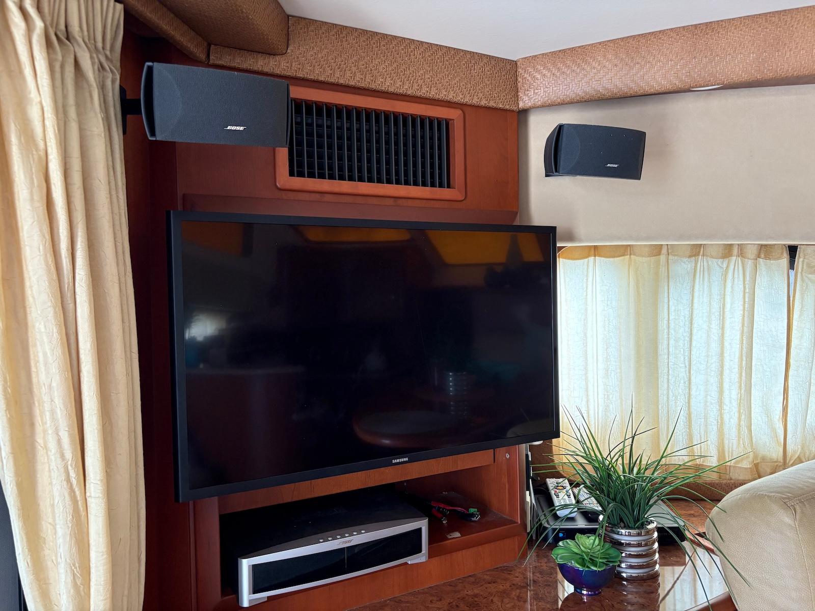 Slide: The Image of Entertainment system with TV and speakers in 2006 Silverton 38 Sport Bridge yacht interior. - 23