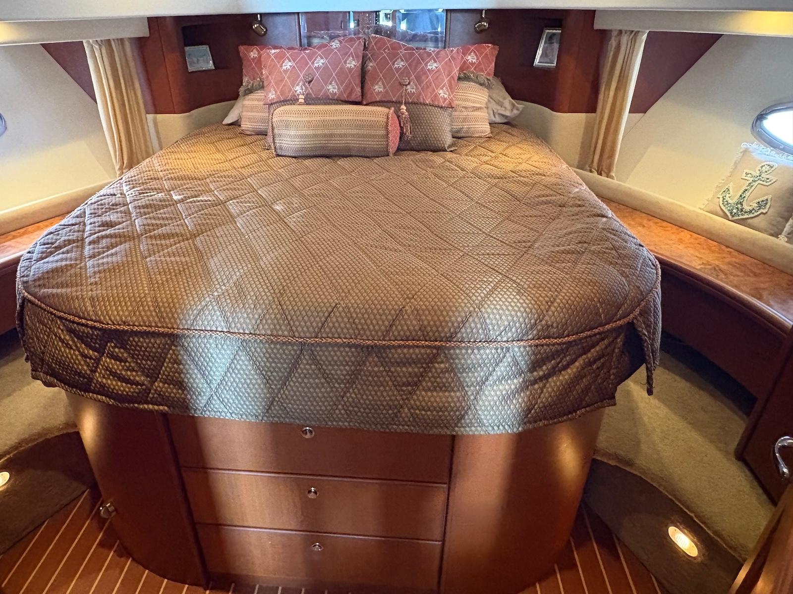 Slide: The Image of Luxurious cabin interior of 2006 Silverton 38 Sport Bridge yacht with plush bedding. - 25
