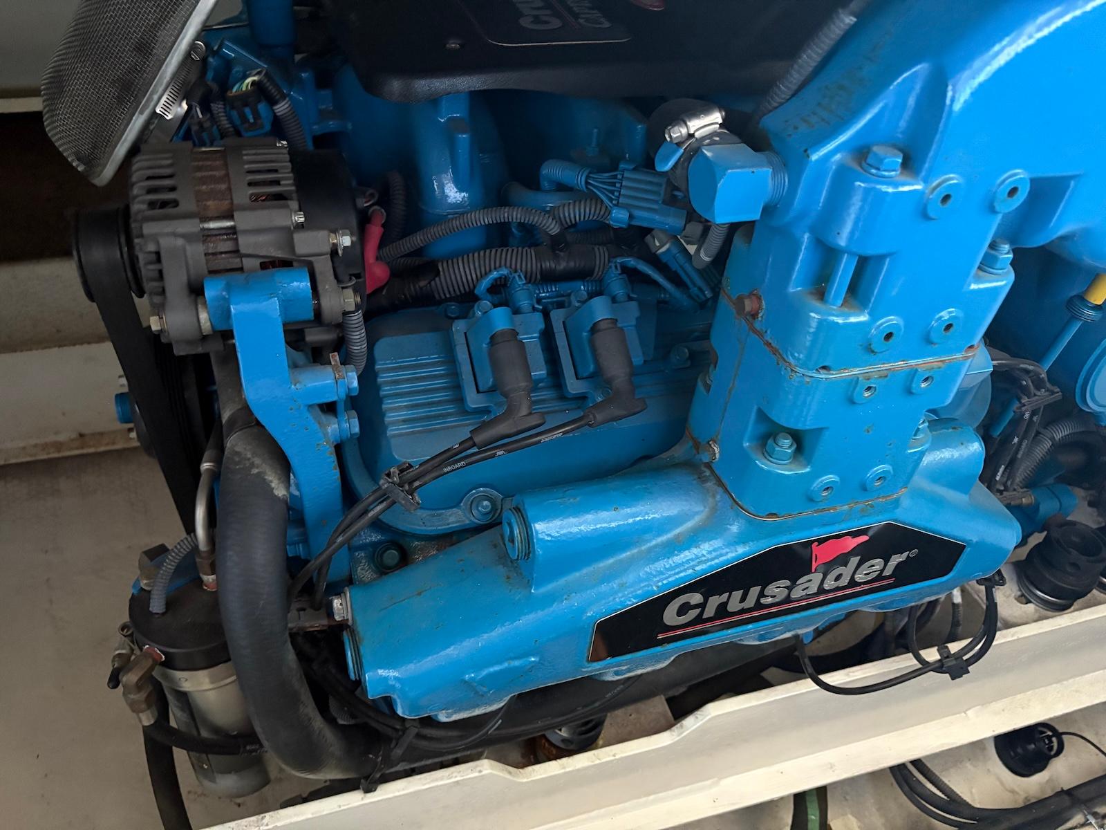 Slide: The Image of Engine of a 2006 Silverton 38 Sport Bridge with Crusader branding. - 31