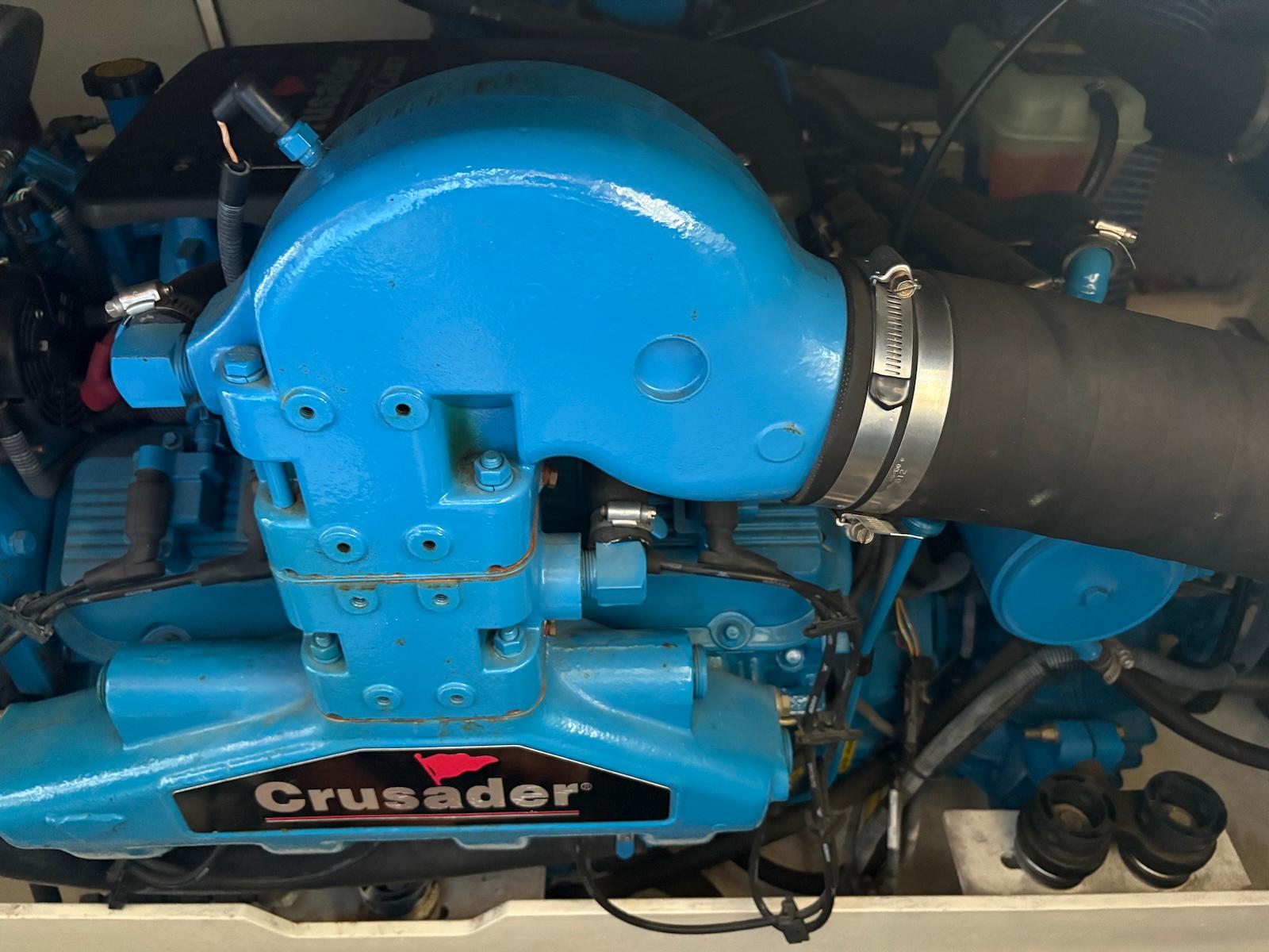 Slide: The Image of Engine of a 2006 Silverton 38 Sport Bridge with Crusader branding. - 33