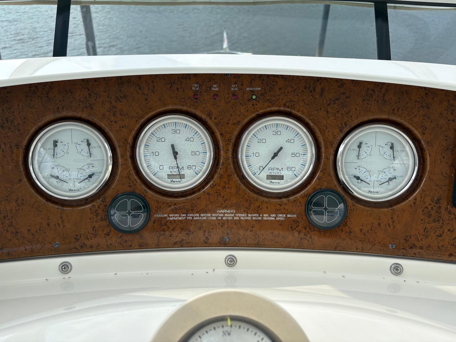 Slide: The Image of Dashboard of a 2006 Silverton 38 Sport Bridge with gauges and controls. - 4