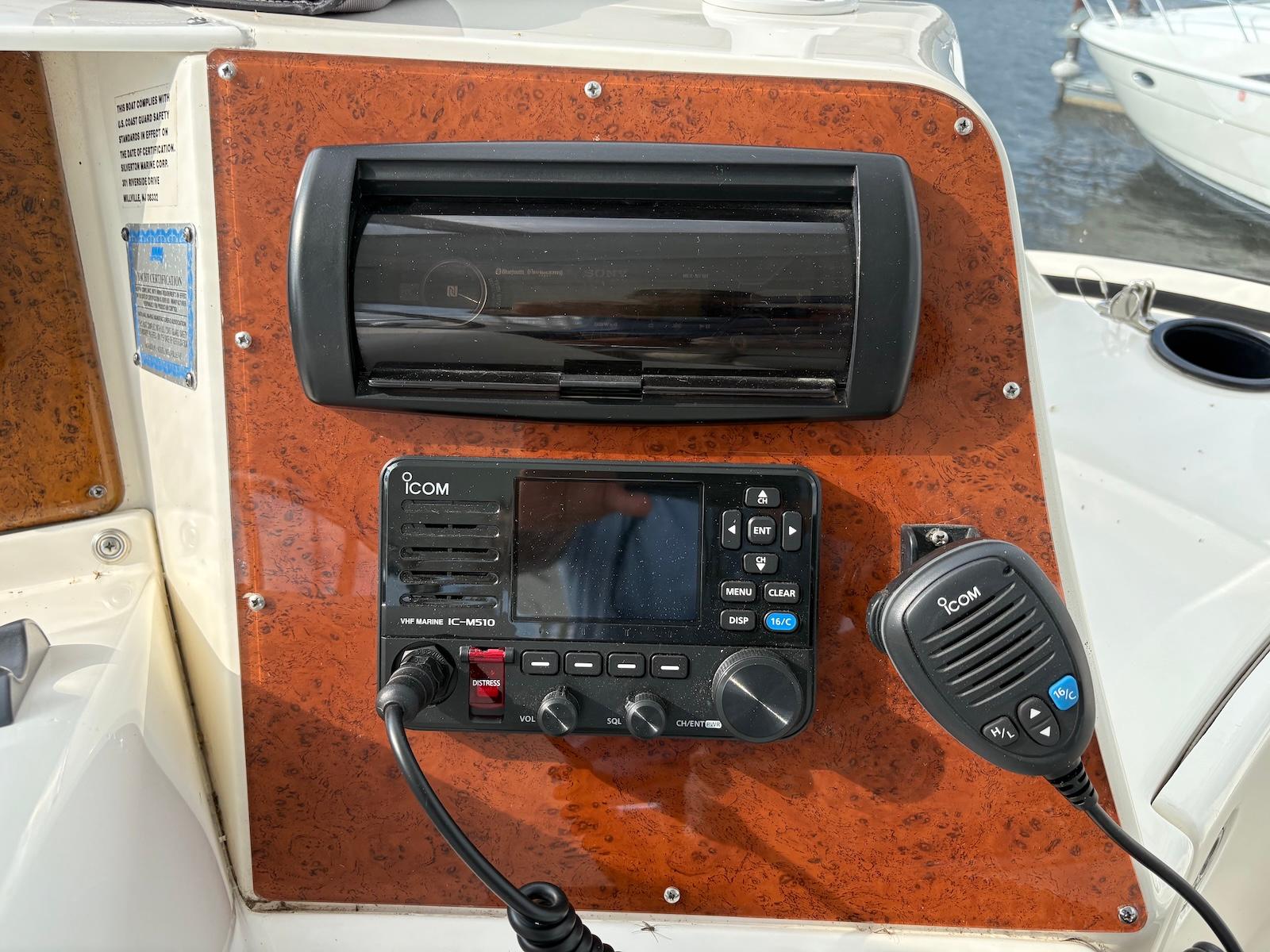 Slide: The Image of Control panel of a 2006 Silverton 38 Sport Bridge with Icom marine radio. - 5