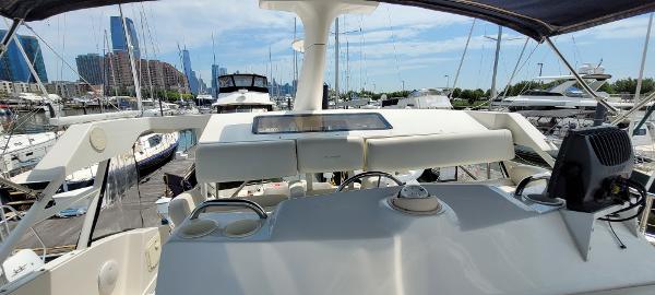Slide: The Image of View from the helm of a 2000 Silverton 392 Motor Yacht docked at a marina. - 7