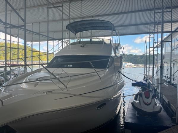 Slide: The Image of 2002 Silverton 39 Motor Yacht docked in a covered marina. - 0
