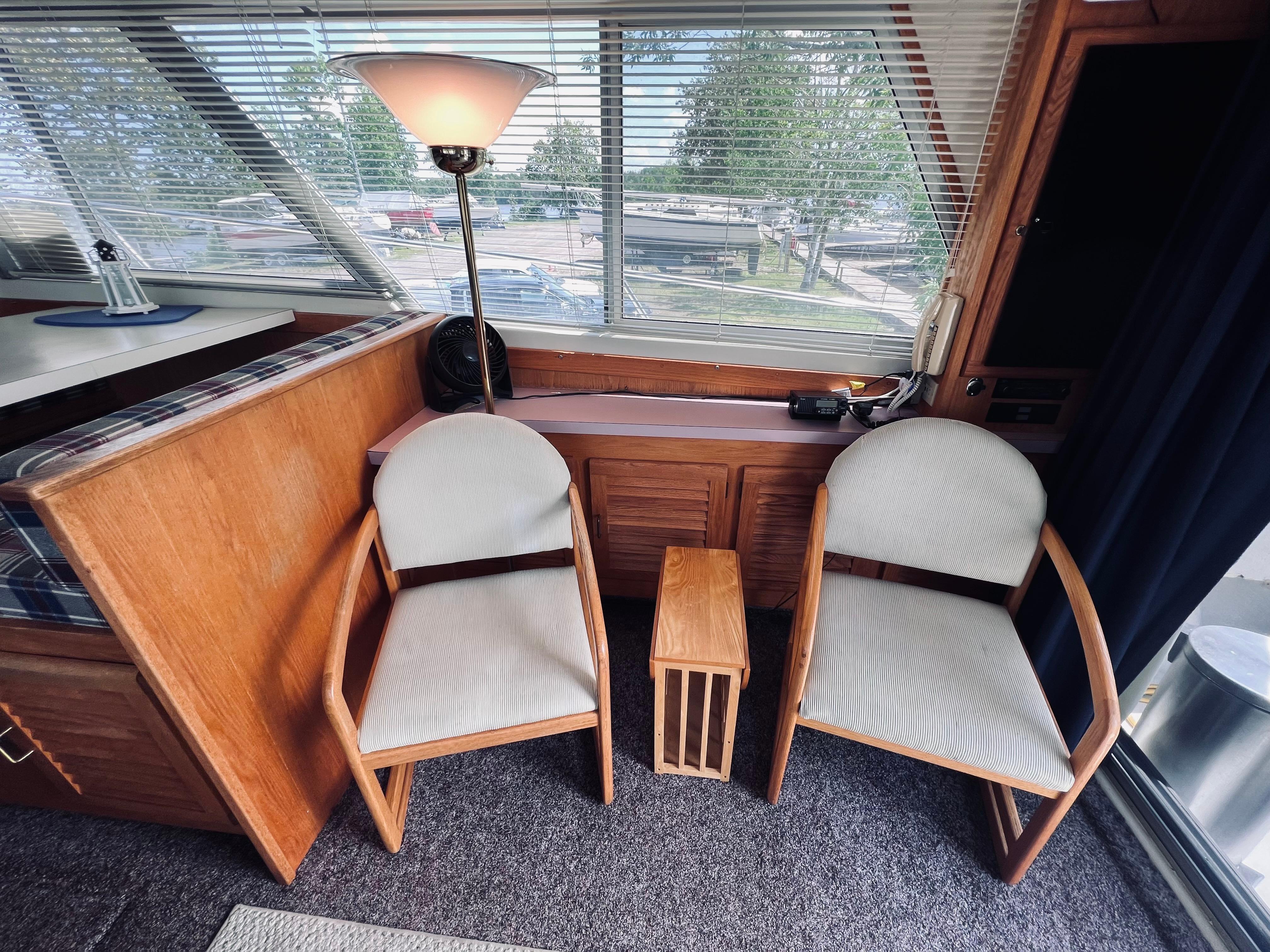 Slide: The Image of Interior of 1988 Silverton 40 Convertible with chairs and table by window. - 10