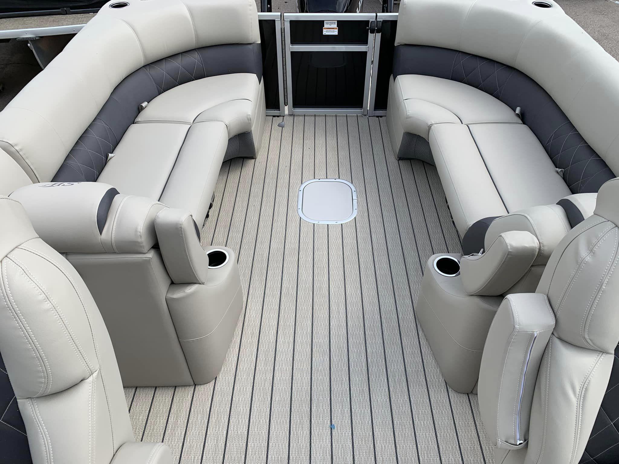 Slide: The Image of 2024 Silver Wave 2610 SW5 CLS pontoon boat interior with luxurious seating and cup holders. - 3