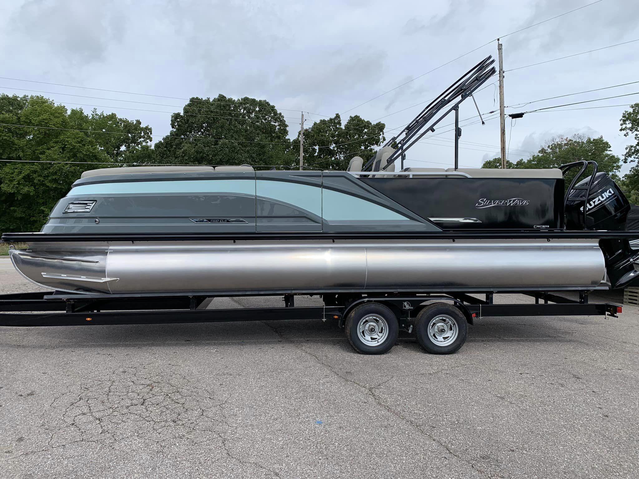 Slide: The Image of 2024 Silver Wave 2610 SW5 CLS pontoon boat on trailer, side view. - 4
