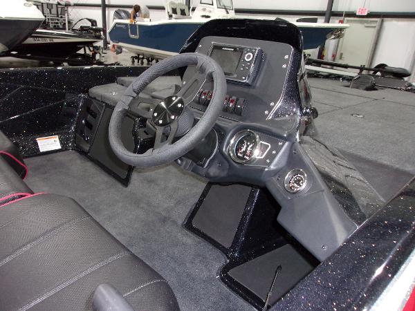 Slide: The Image of 2024 Skeeter ZX-150 boat dashboard with steering wheel and control panel. - 6