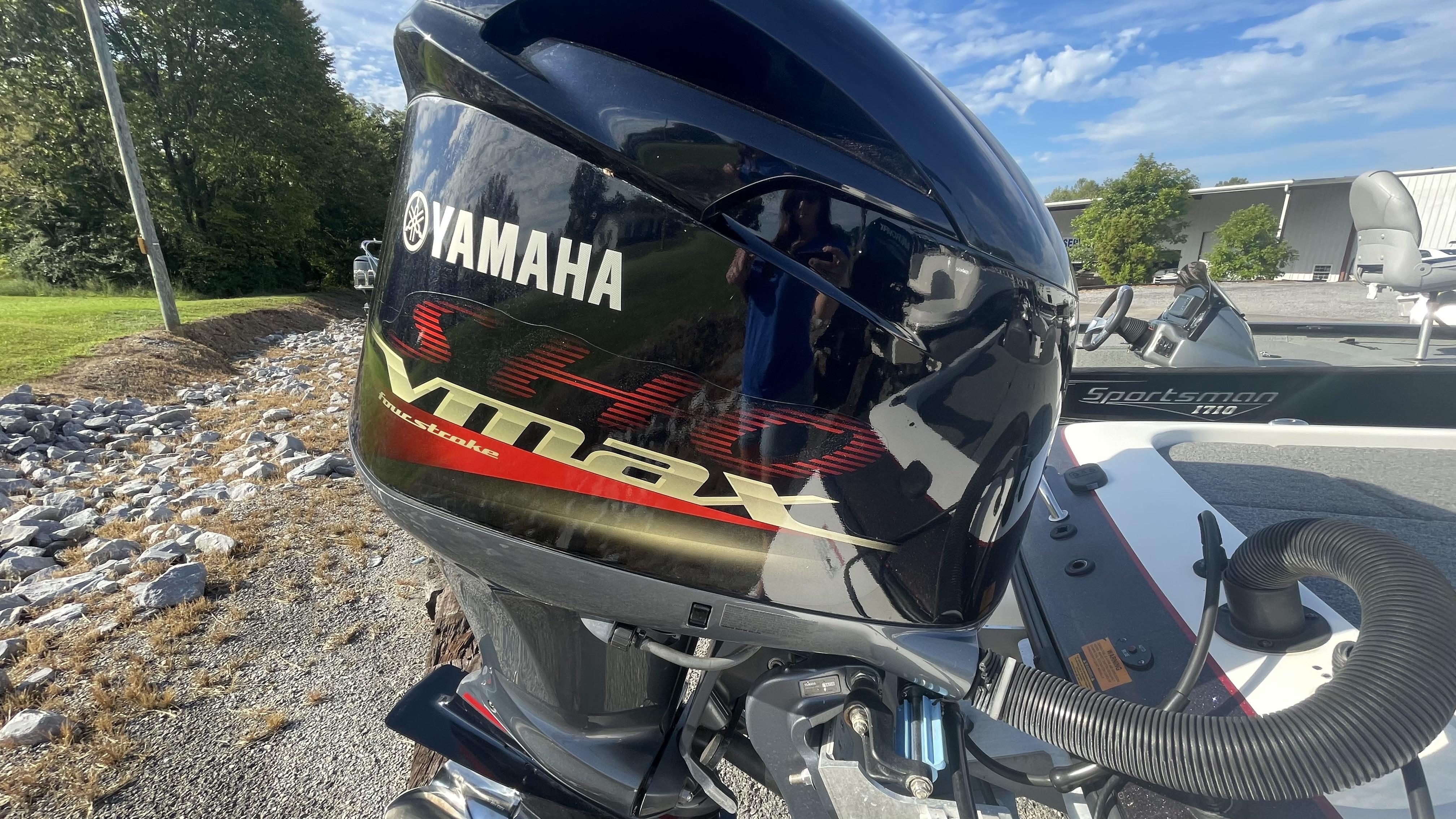 Slide: The Image of Close-up of a Yamaha VMAX outboard motor on a 2011 Skeeter ZX225 boat. - 24
