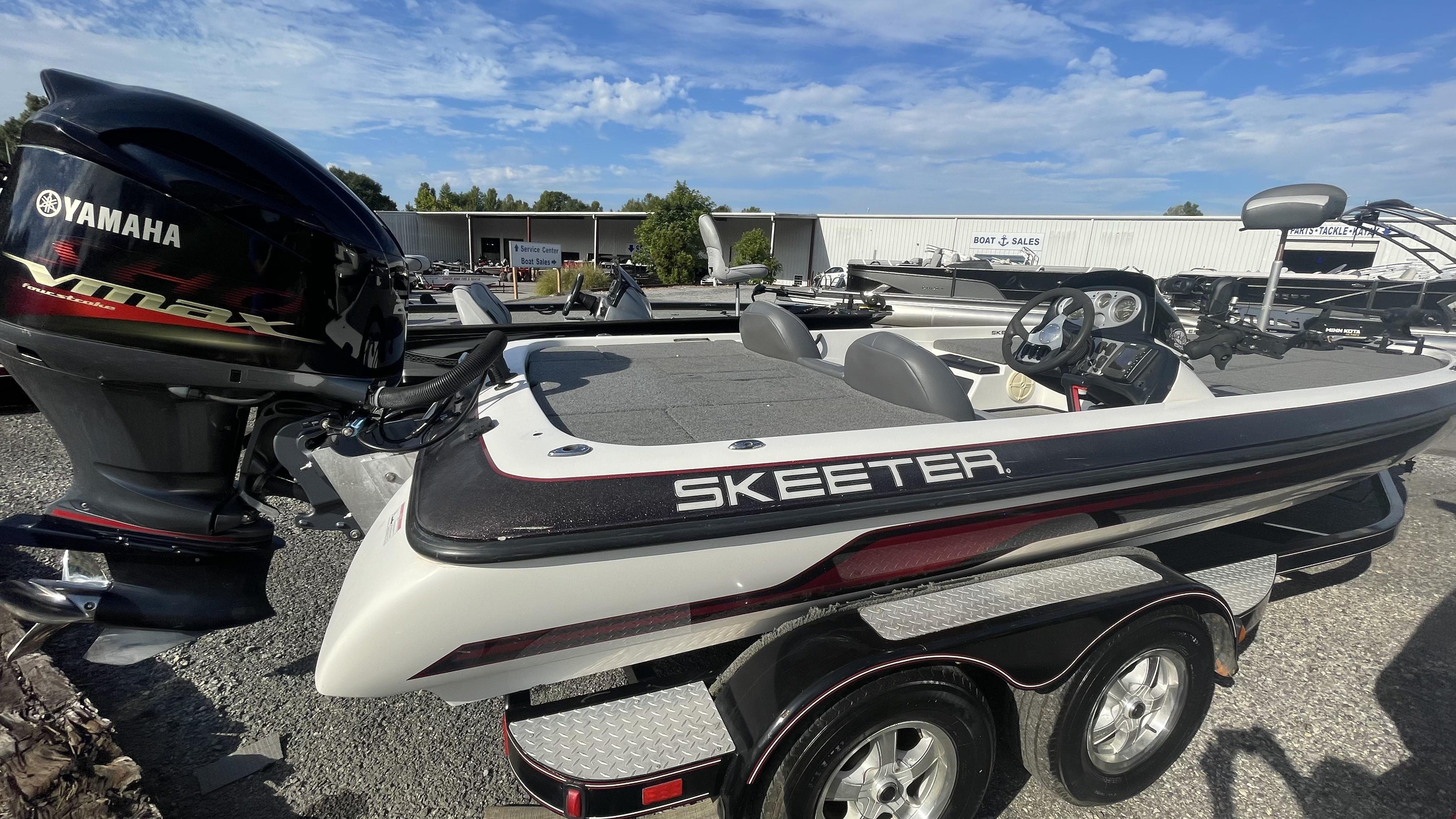 Slide: The Image of 2011 Skeeter ZX225 boat with Yamaha VMAX engine at a boat sales lot. - 4