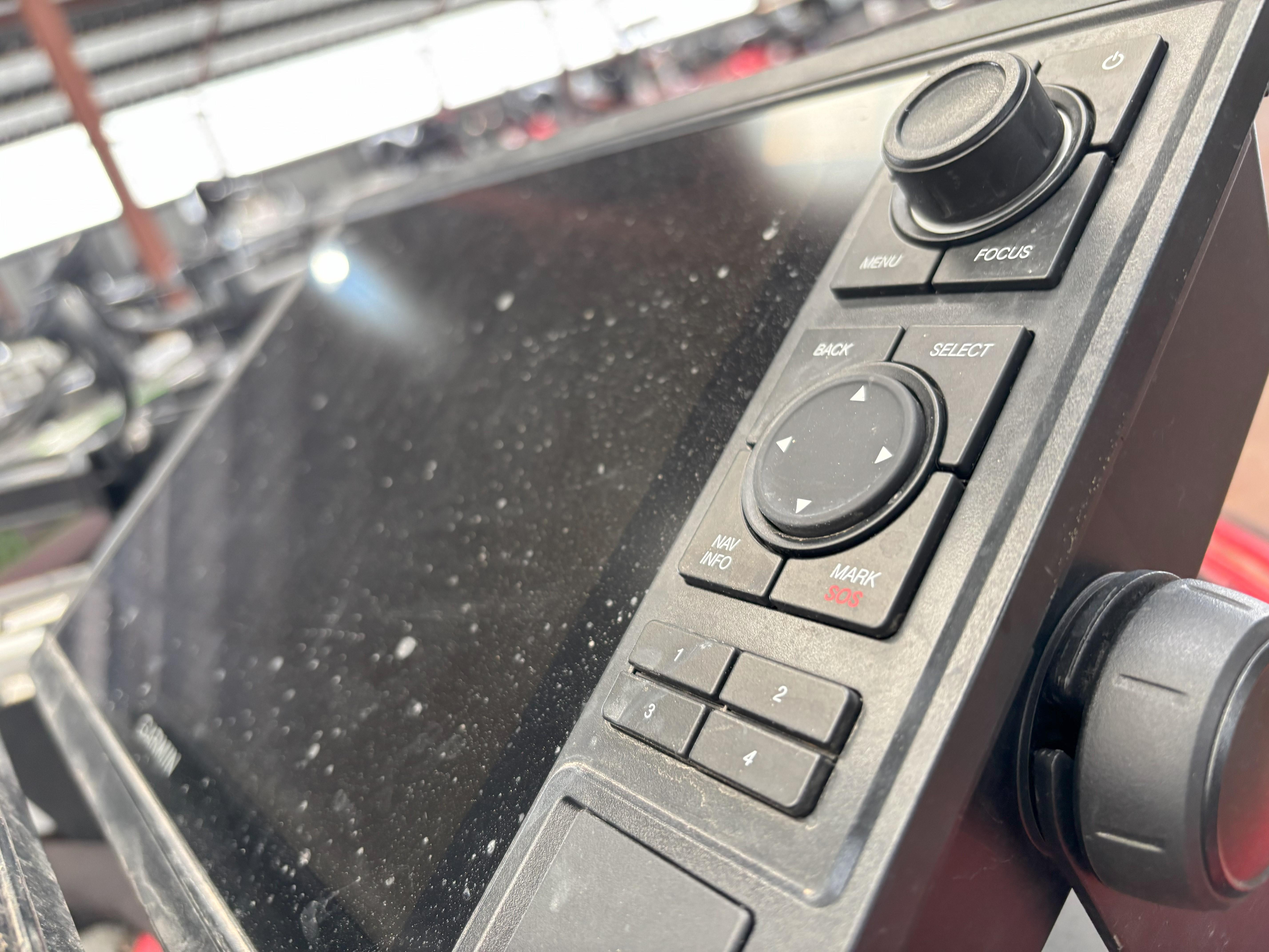 Slide: The Image of Control panel of a 2020 Skeeter FXR20 Apex boat, featuring navigation buttons and display. - 13