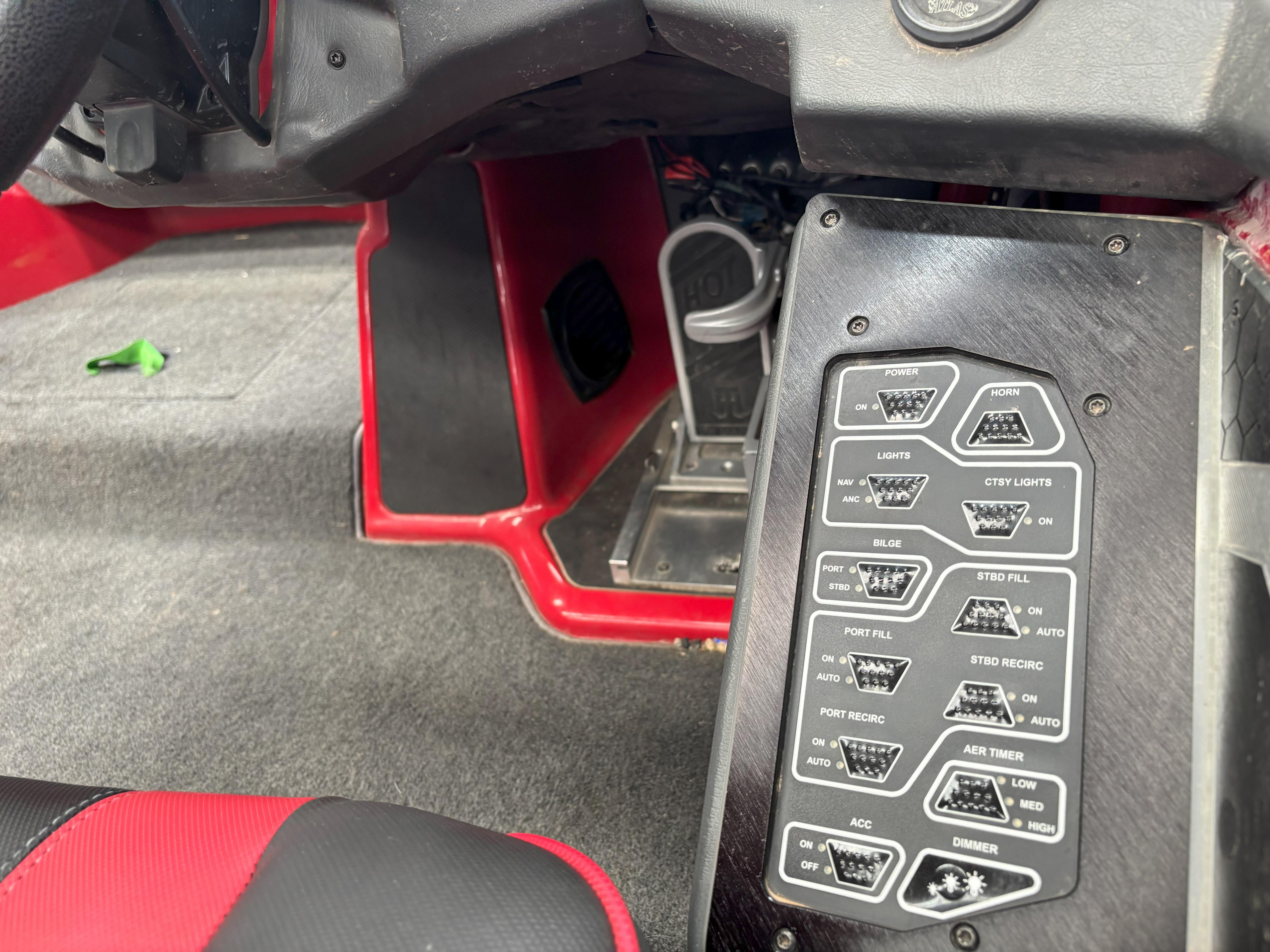 Slide: The Image of Control panel of a 2020 Skeeter FXR20 Apex boat, featuring various switches and settings. - 16
