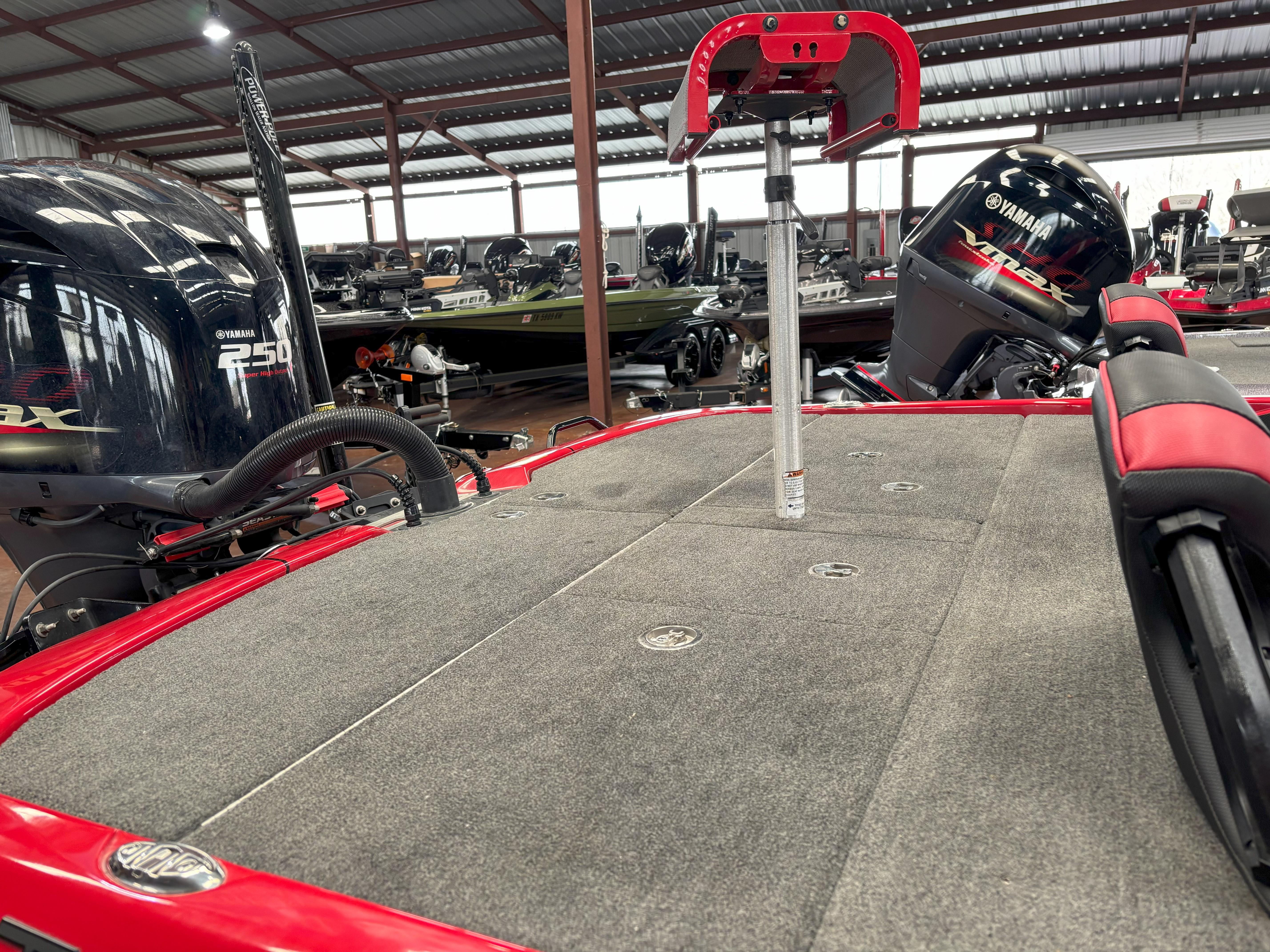 Slide: The Image of 2020 Skeeter FXR20 Apex boat with Yamaha R250 engine in a covered storage area. - 18