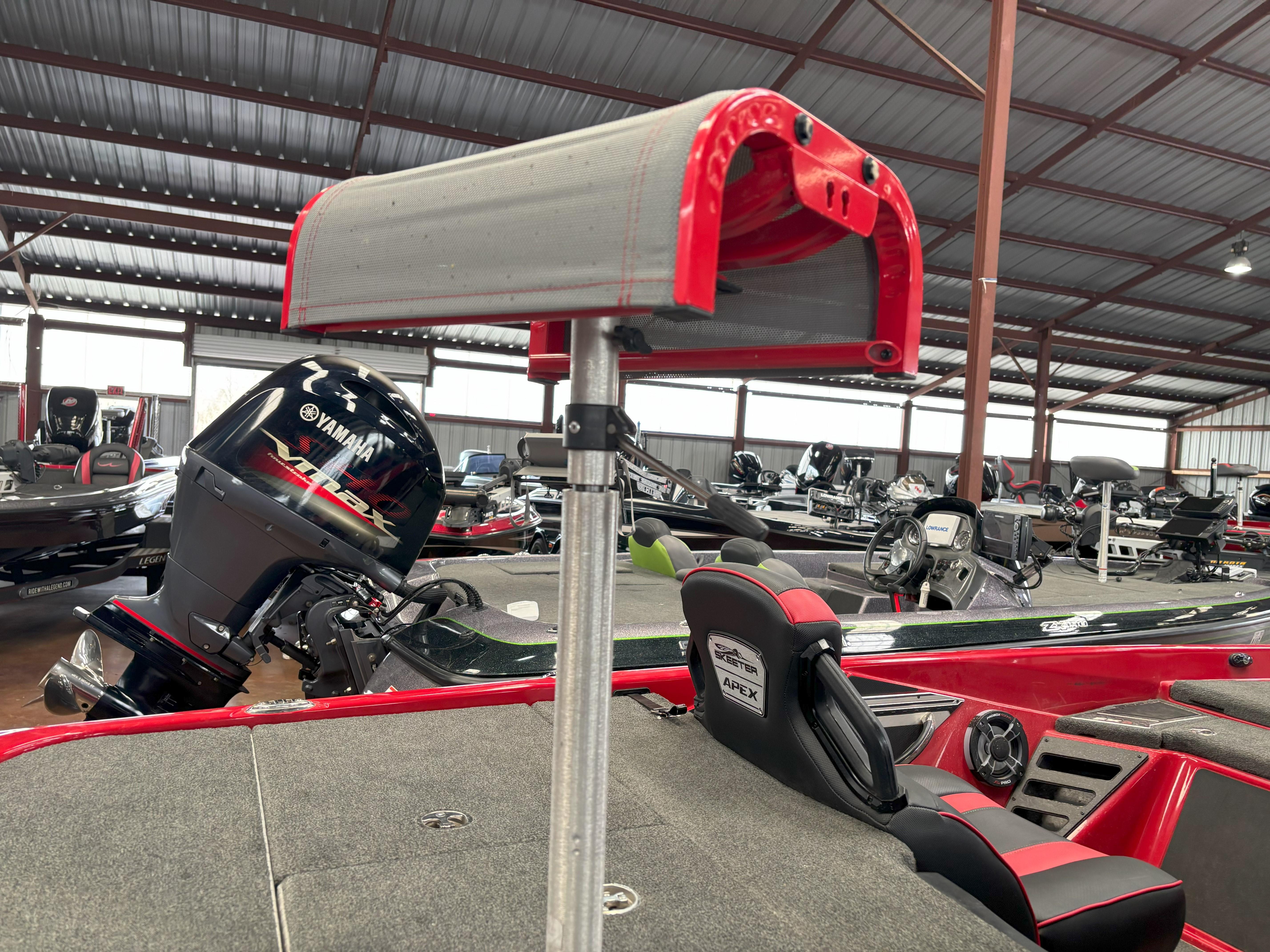 Slide: The Image of 2020 Skeeter FXR20 Apex boat with Yamaha engine in a storage facility. - 19