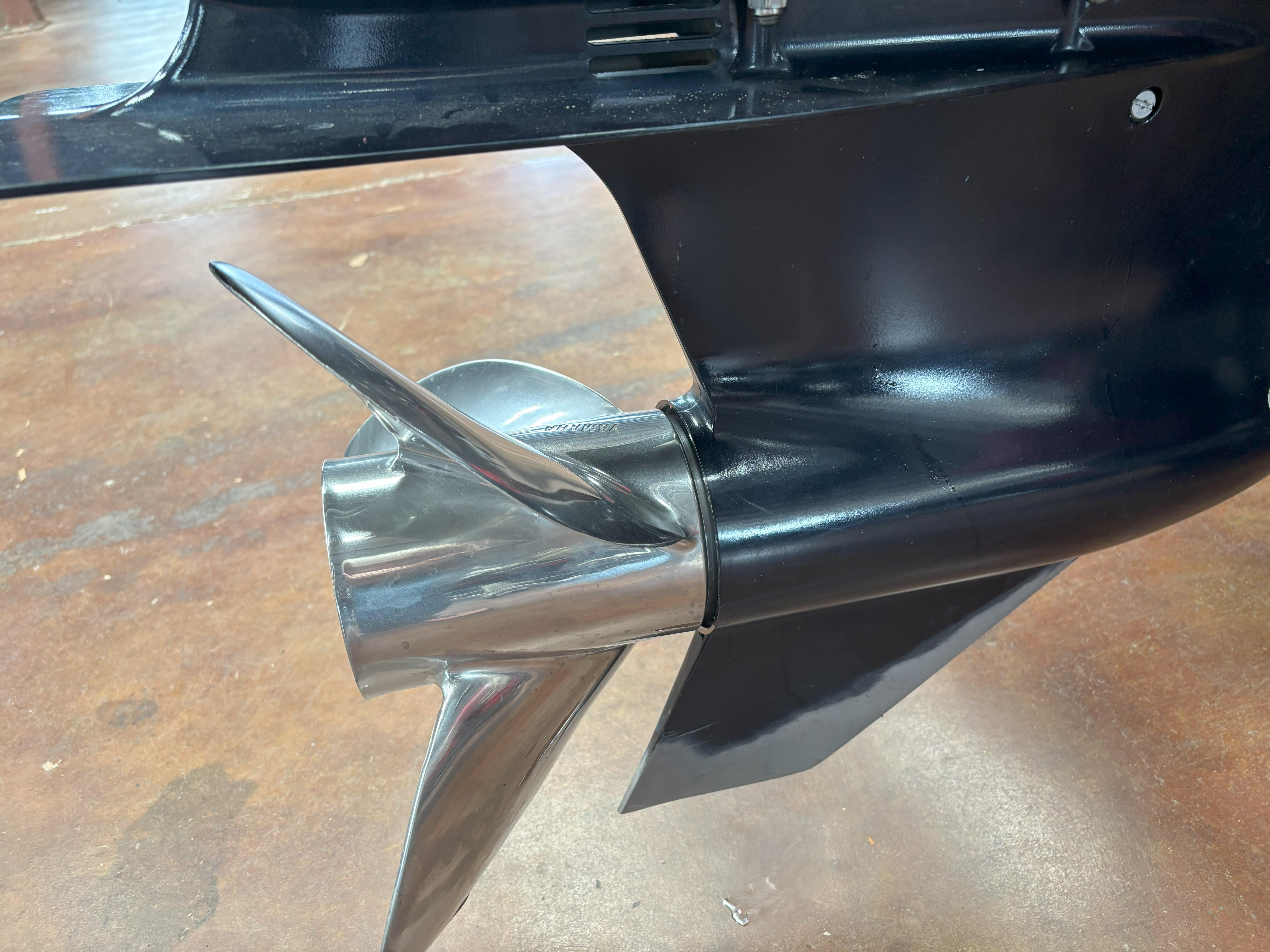Slide: The Image of Skeeter FXR20 Apex 2020 boat propeller, shiny metal blades on a wooden floor. - 22