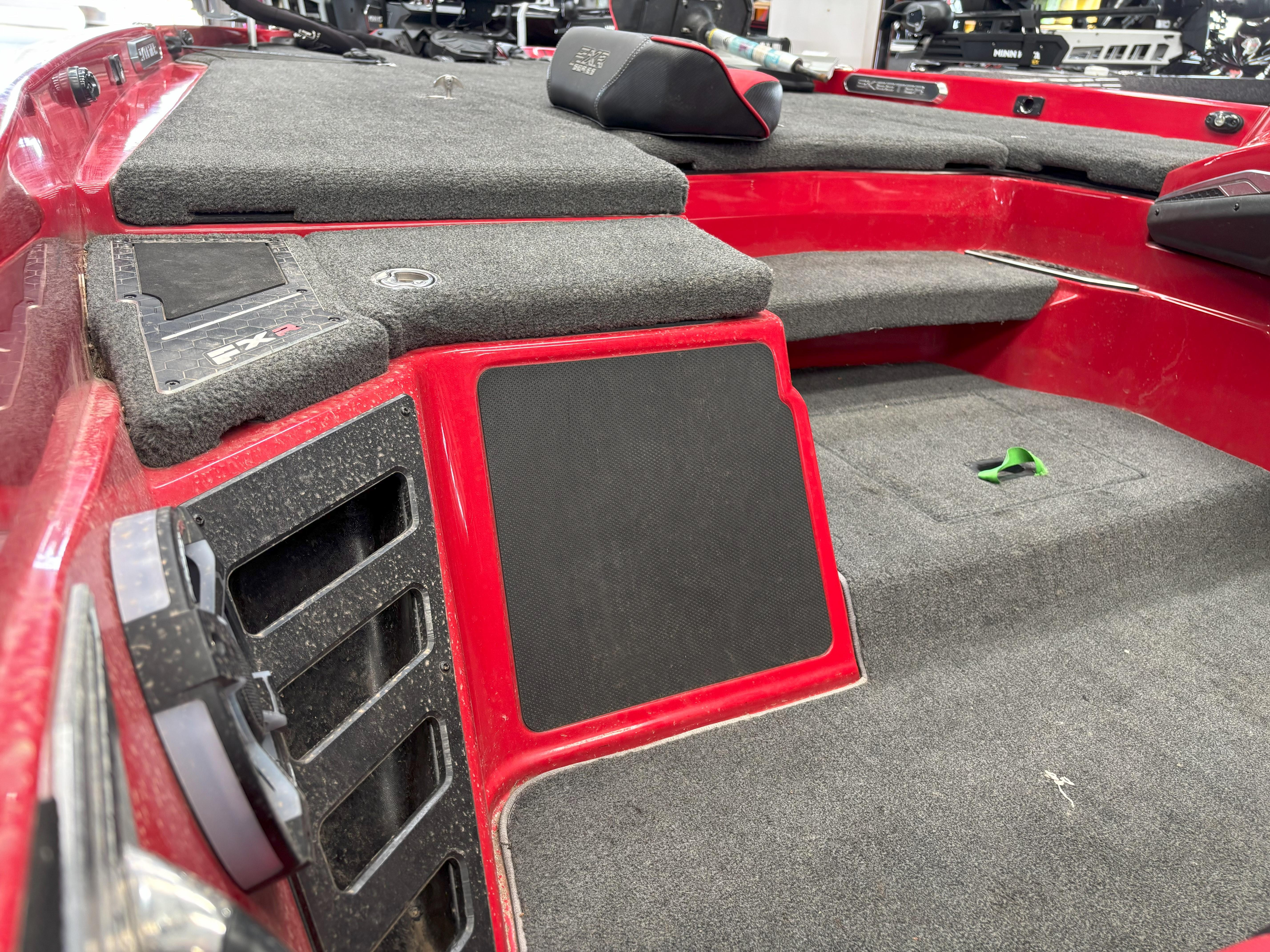 Slide: The Image of 2020 Skeeter FXR20 Apex boat interior with red and gray detailing. - 8