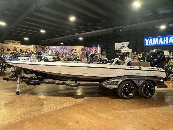 Slide: The Image of 2023 Skeeter FXR21 Limited boat on display in a showroom. - 1