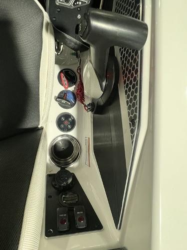 Slide: The Image of 2023 Skeeter FXR21 Limited boat dashboard with steering wheel and control panel. - 10