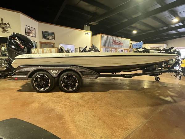 Slide: The Image of 2023 Skeeter FXR21 Limited boat on display in a showroom. - 5