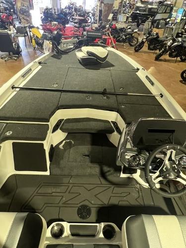 Slide: The Image of 2023 Skeeter FXR21 Limited boat interior with steering console and storage compartments. - 8