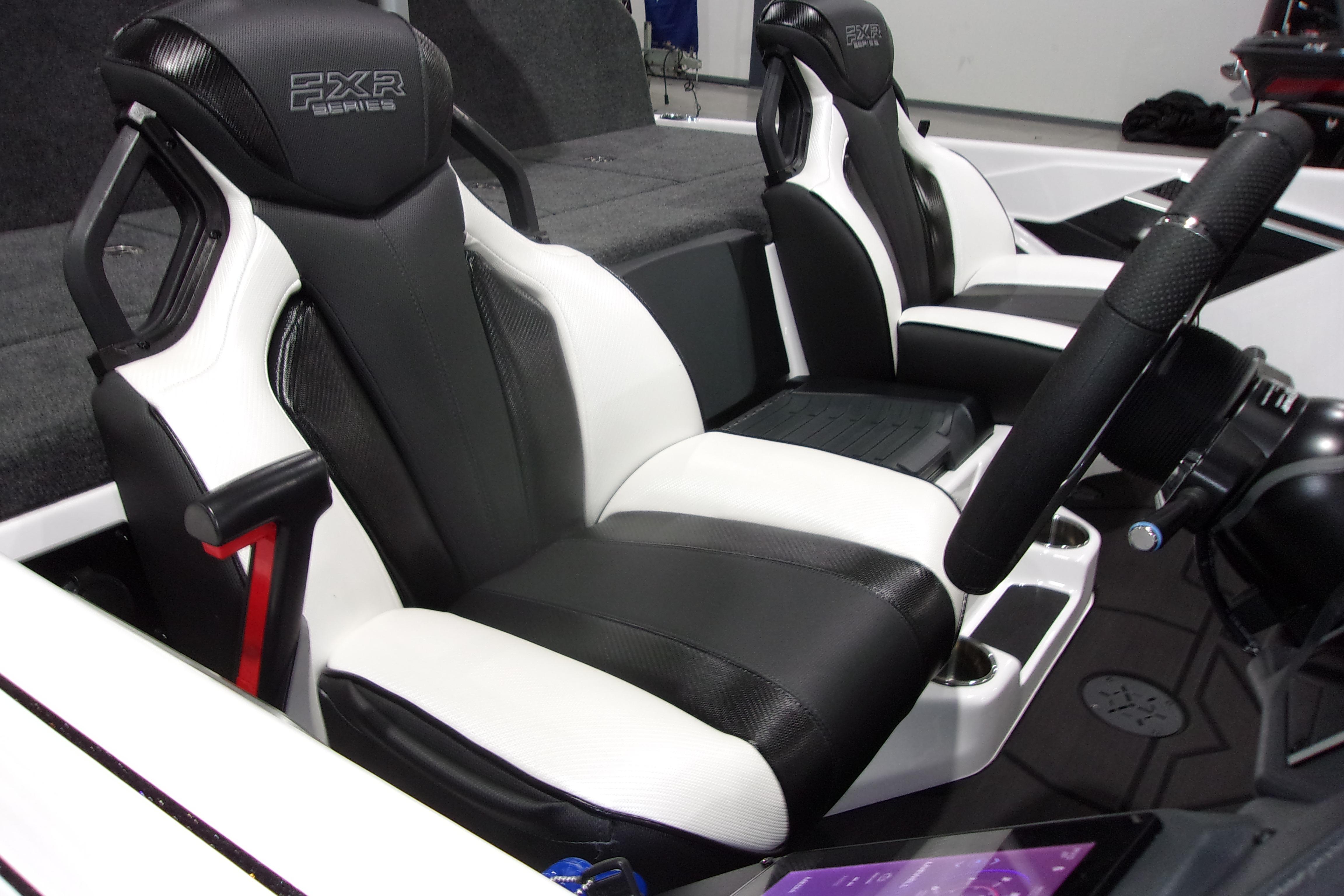 Slide: The Image of 2025 Skeeter FXR21 Limited boat interior with black and white seats and steering wheel. - 14