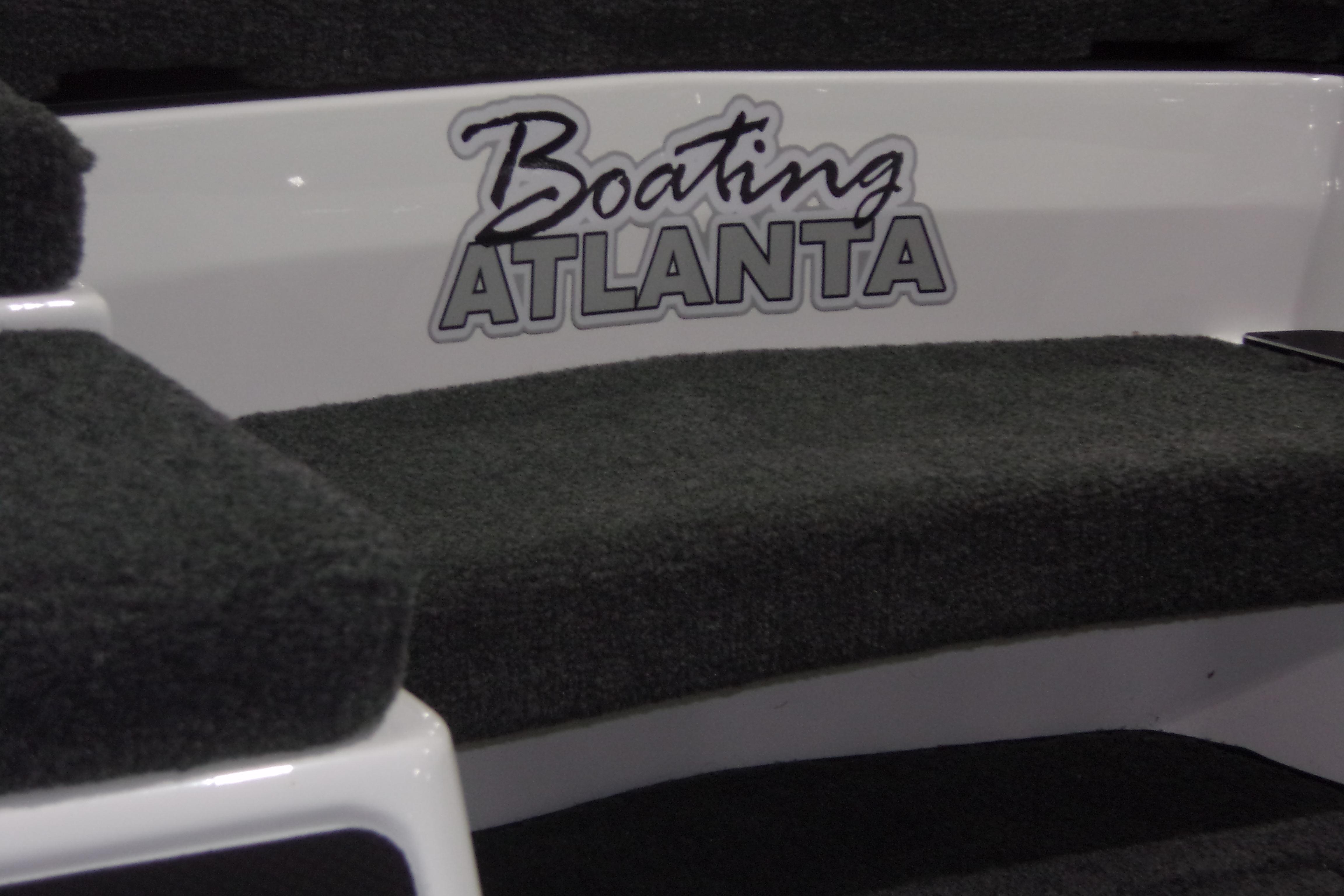 Slide: The Image of 2025 Skeeter FXR21 Limited boat with "Boating Atlanta" logo on carpeted step. - 17