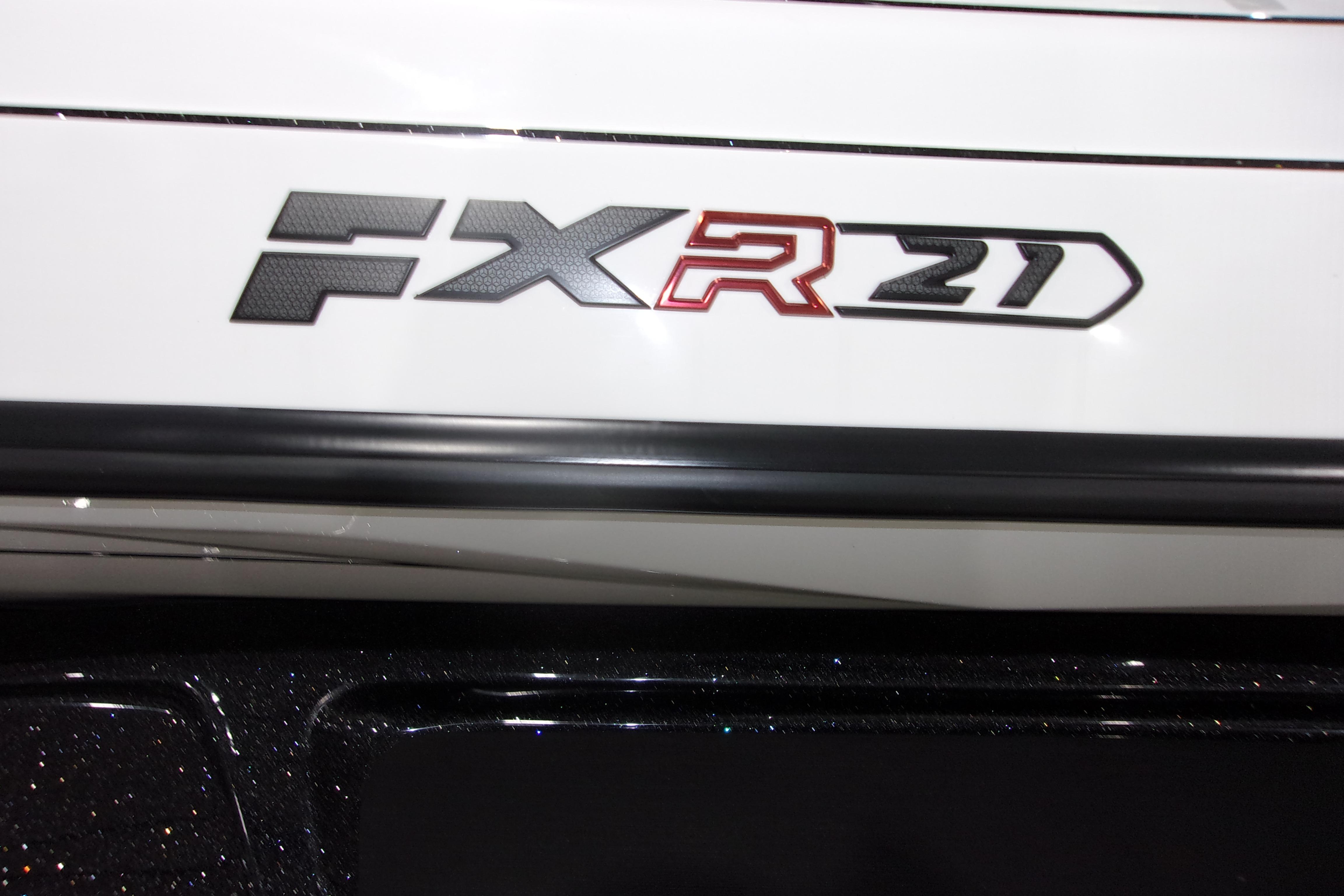 Slide: The Image of 2025 Skeeter FXR21 Limited logo on a sleek white surface. - 18