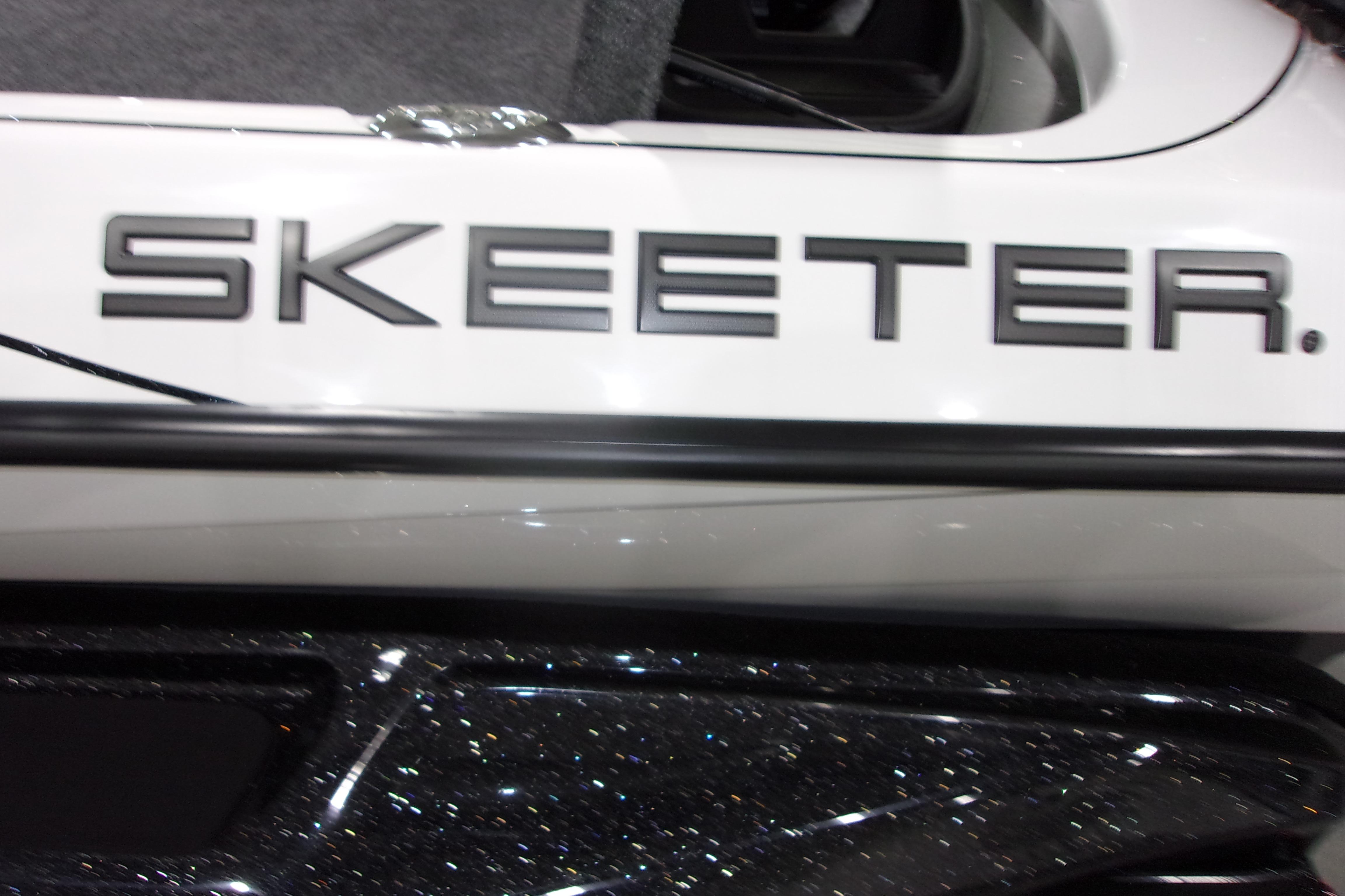 Slide: The Image of 2025 Skeeter FXR21 Limited boat with sleek design and bold branding. - 19