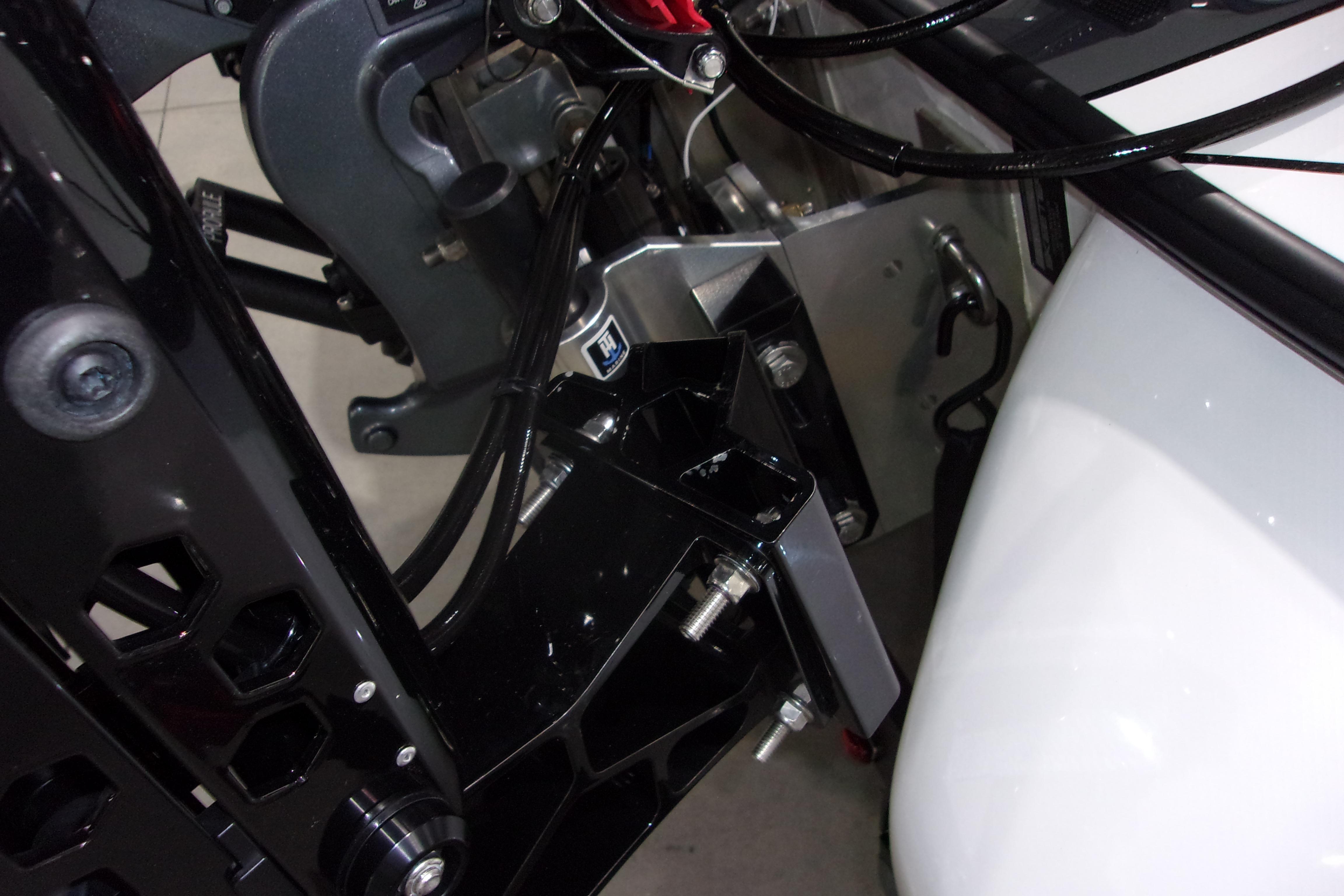 Slide: The Image of Close-up of 2025 Skeeter FXR21 Limited boat engine components and wiring. - 9
