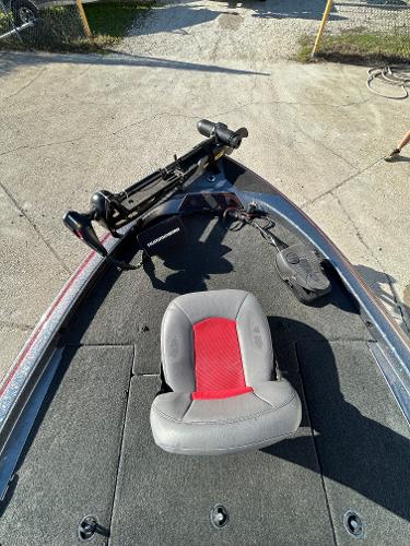 Slide: The Image of 2003 Skeeter SX 200 boat with a single seat and trolling motor. - 21