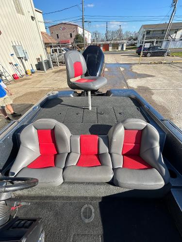 Slide: The Image of 2003 Skeeter SX 200 boat with red and gray seating. - 24