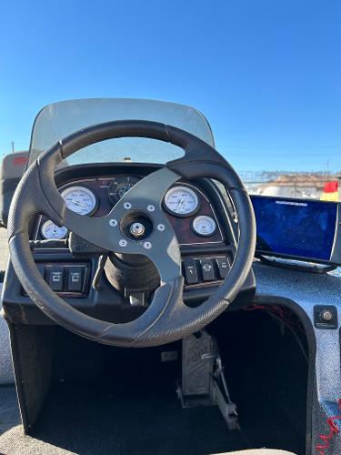 Slide: The Image of Steering console of a 2003 Skeeter SX 200 boat with gauges and navigation screen. - 28
