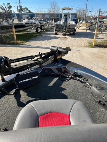 Slide: The Image of 2003 Skeeter SX 200 boat with Humminbird fish finder at a marina. - 29
