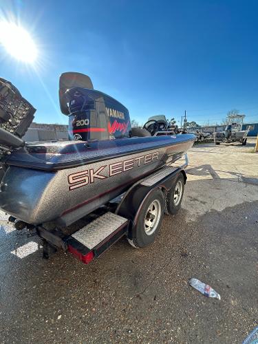 Slide: The Image of 2003 Skeeter SX 200 boat with Yamaha 200 motor on trailer. - 34
