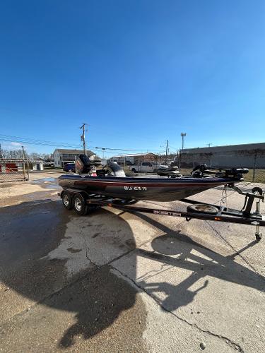 Slide: The Image of 2003 Skeeter SX 200 fishing boat on a trailer in a parking lot. - 9