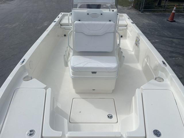 Slide: The Image of 2023 Skeeter SX210 boat interior with white seating and storage compartments. - 15