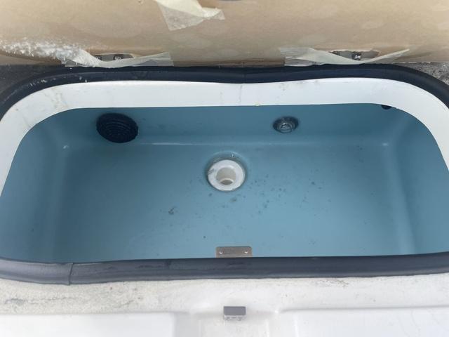 Slide: The Image of 2023 Skeeter SX210 livewell compartment, empty and clean. - 16