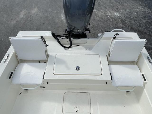 Slide: The Image of 2023 Skeeter SX210 boat stern with seating and outboard motor. - 18