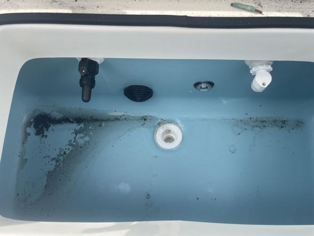 Slide: The Image of Livewell tank of 2023 Skeeter SX210 boat with water and fittings. - 19