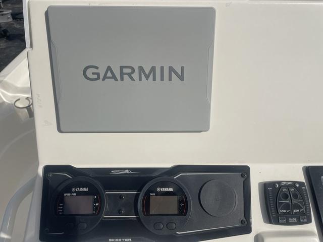Slide: The Image of 2023 Skeeter SX210 boat dashboard with Garmin navigation system and Yamaha gauges. - 20