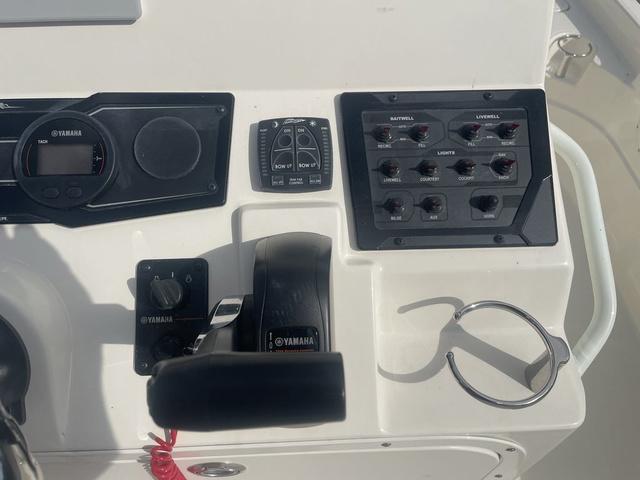Slide: The Image of Control panel of a 2023 Skeeter SX210 boat with Yamaha components. - 21