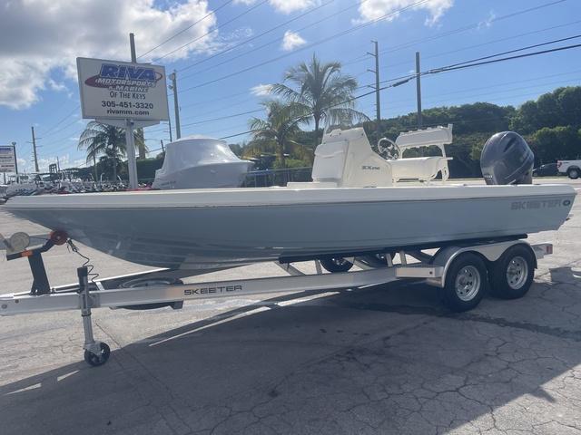 Slide: The Image of 2023 Skeeter SX210 boat on a trailer at a dealership. - 3