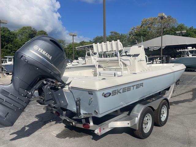Slide: The Image of 2023 Skeeter SX210 boat with Yamaha outboard motor on a trailer. - 6
